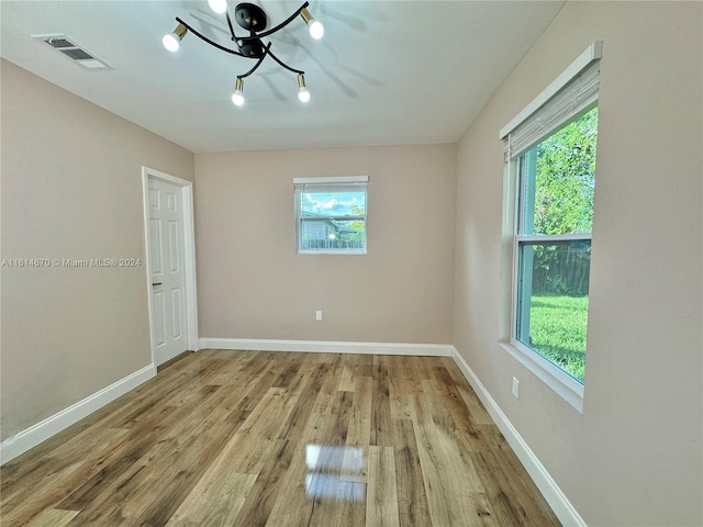 spare room featuring light hardwood / wood-style flooring