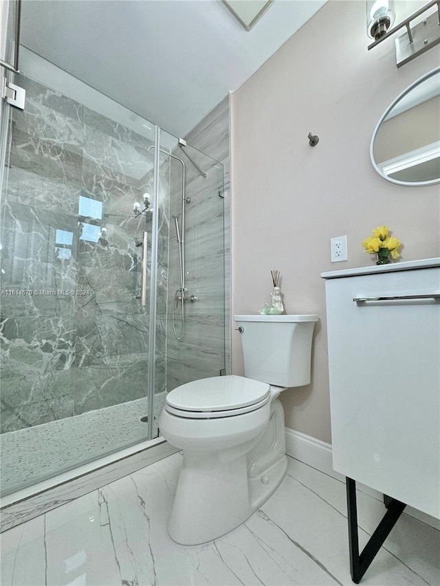 bathroom featuring toilet and an enclosed shower