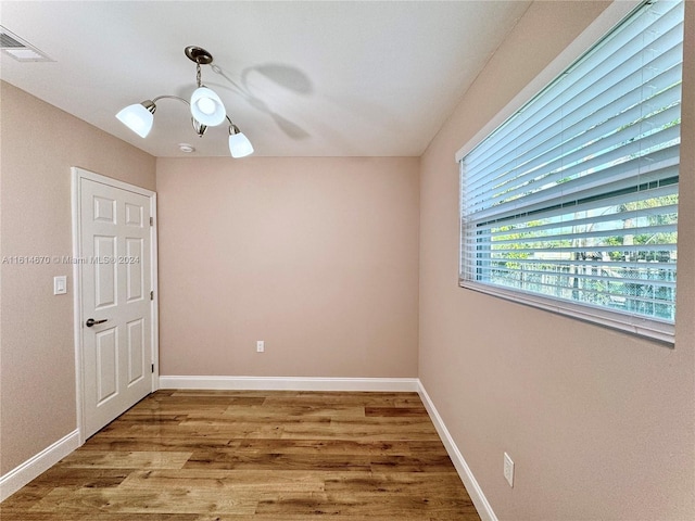 unfurnished room with wood-type flooring and ceiling fan