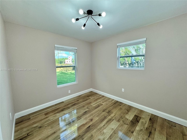 spare room featuring hardwood / wood-style flooring