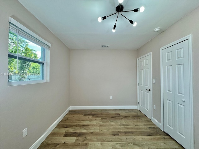 spare room with light hardwood / wood-style flooring