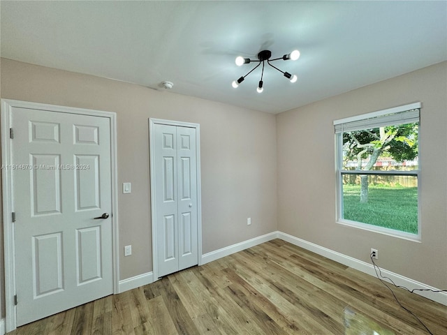 unfurnished room with light hardwood / wood-style floors