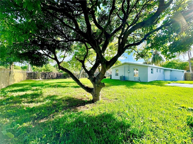 view of yard with central AC