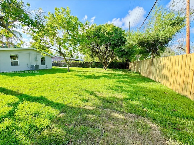 view of yard featuring central AC unit