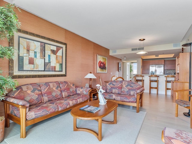 living room with light hardwood / wood-style floors