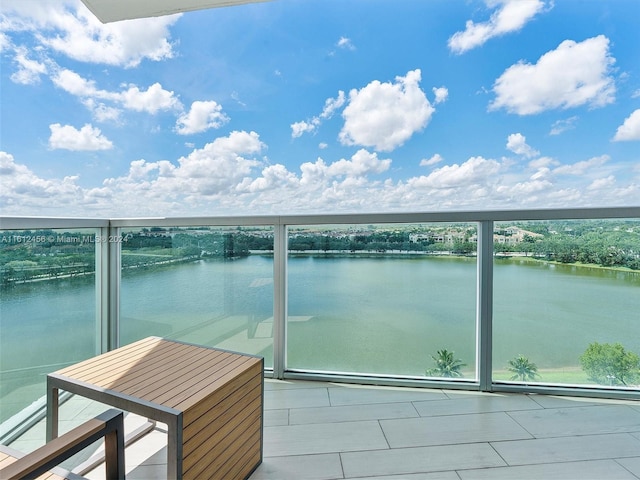 balcony featuring a water view