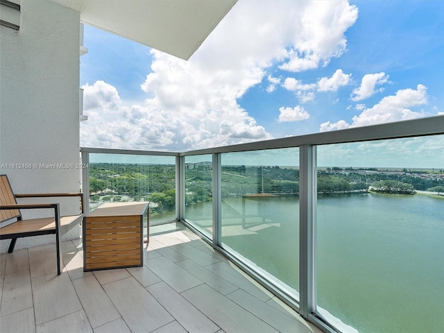 balcony featuring a water view