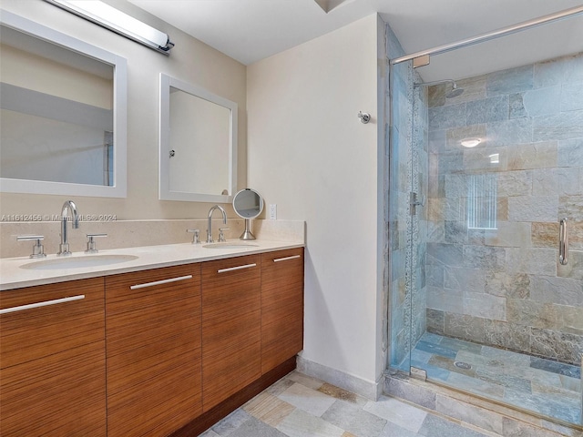 bathroom with an enclosed shower and vanity