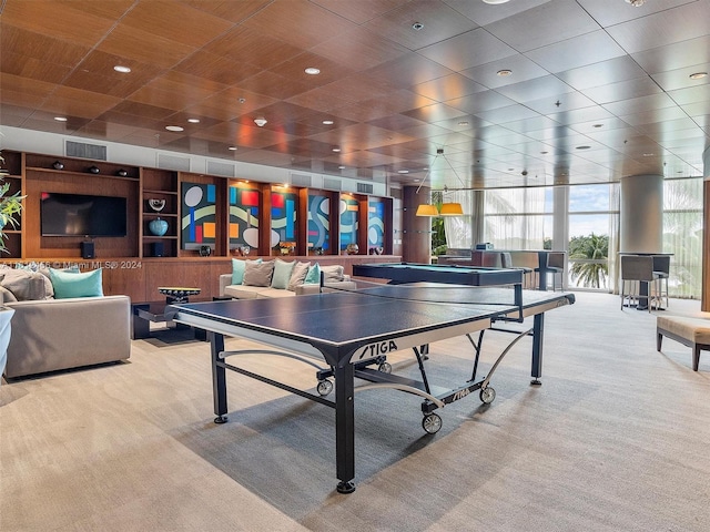 recreation room with light carpet and expansive windows