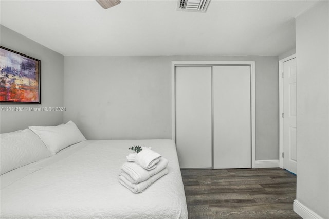 bedroom featuring dark wood-type flooring