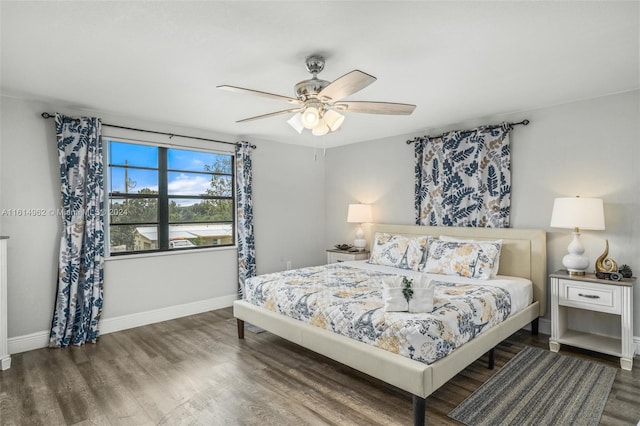 bedroom featuring ceiling fan and dark hardwood / wood-style flooring