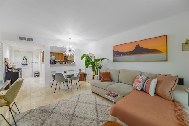 living room featuring an inviting chandelier and light tile patterned floors