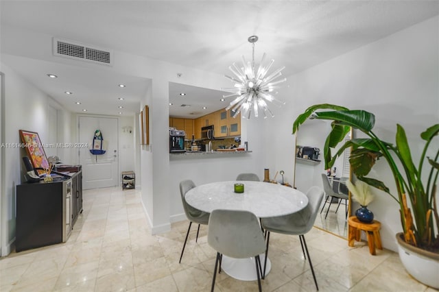 dining space featuring an inviting chandelier