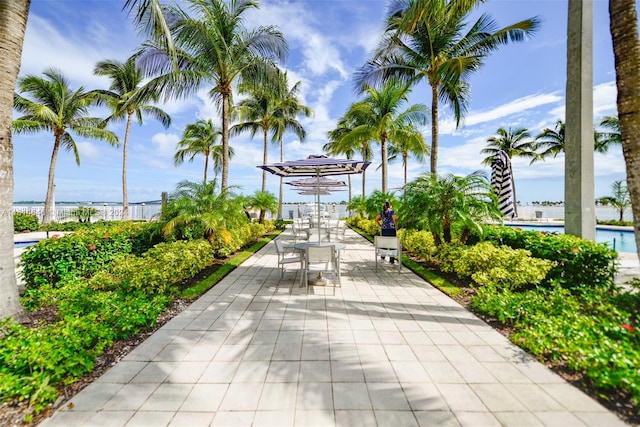 view of property's community with a patio