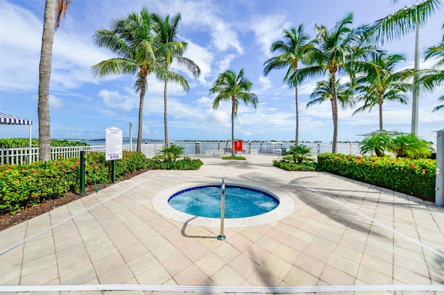 view of swimming pool with a patio and a community hot tub