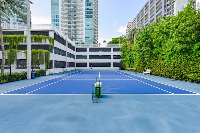 view of sport court with basketball hoop