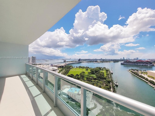 balcony featuring a water view