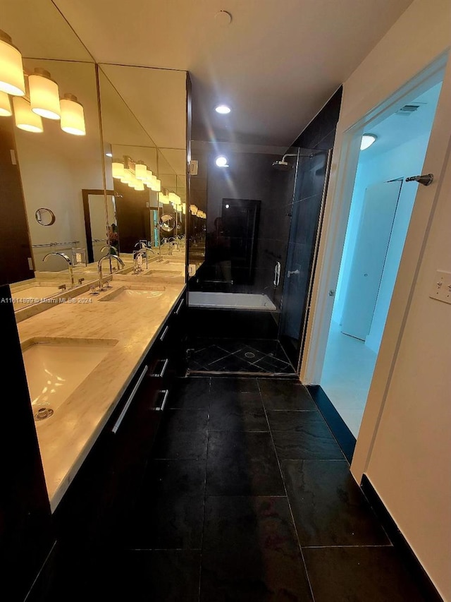 bathroom featuring vanity, tile patterned floors, and walk in shower