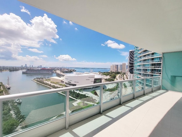 balcony featuring a water view