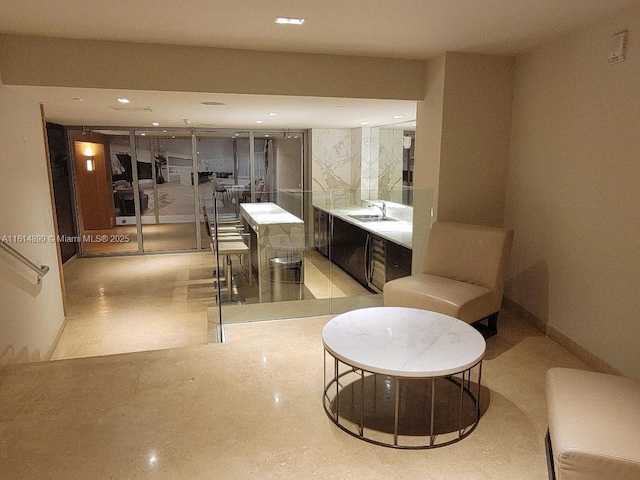 interior space with a sink and recessed lighting