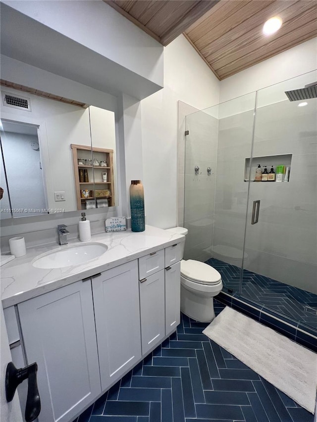 bathroom with tile patterned floors, a textured ceiling, toilet, vanity, and tile walls