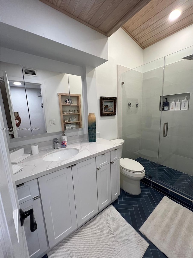 kitchen with kitchen peninsula, sink, light tile patterned floors, white cabinets, and stainless steel refrigerator