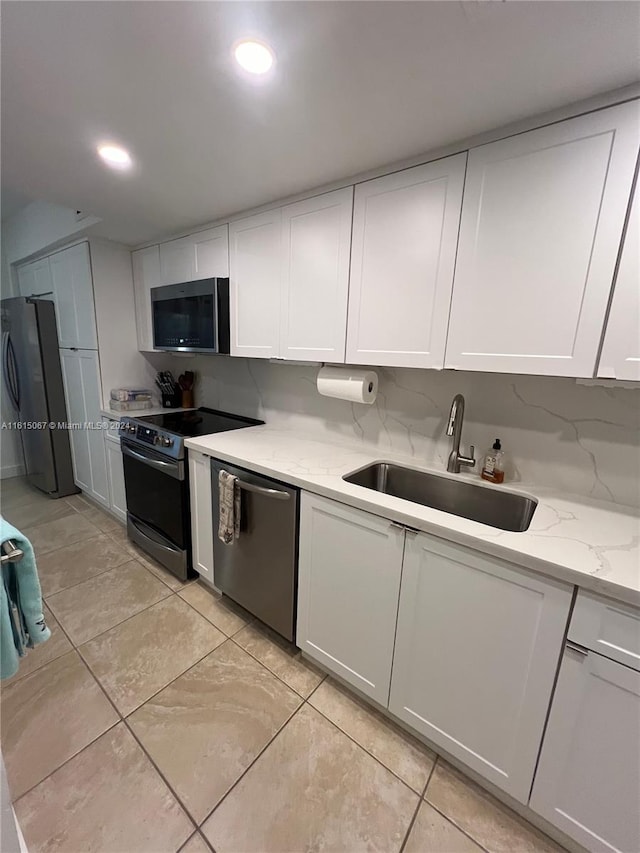 kitchen with decorative backsplash, white cabinetry, and wine cooler