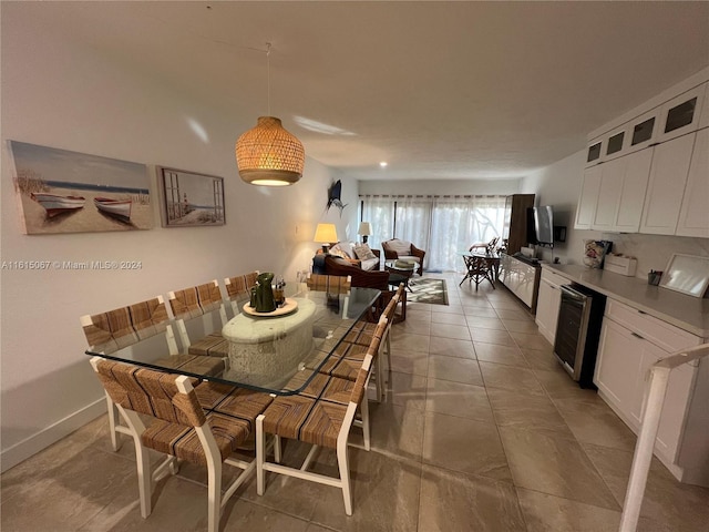 tiled dining room featuring wine cooler