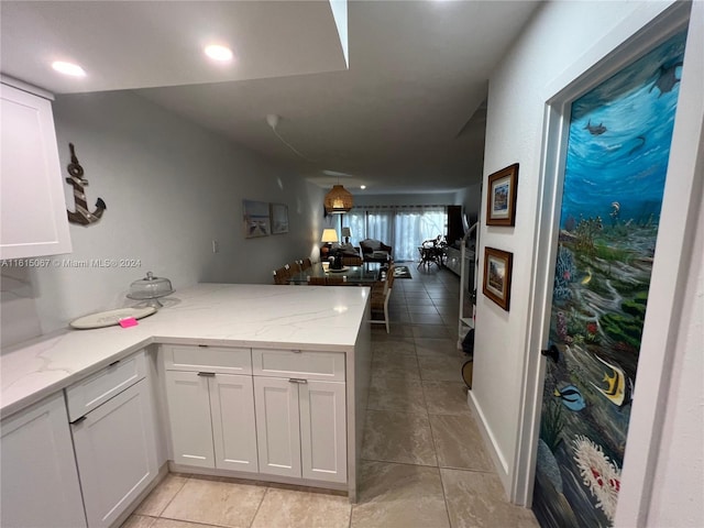 dining room with dark tile patterned floors and wine cooler