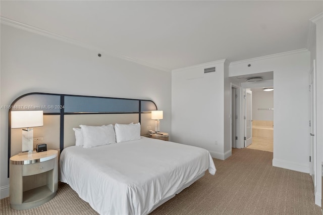 carpeted bedroom with connected bathroom and ornamental molding