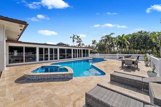 view of pool featuring an in ground hot tub and a patio