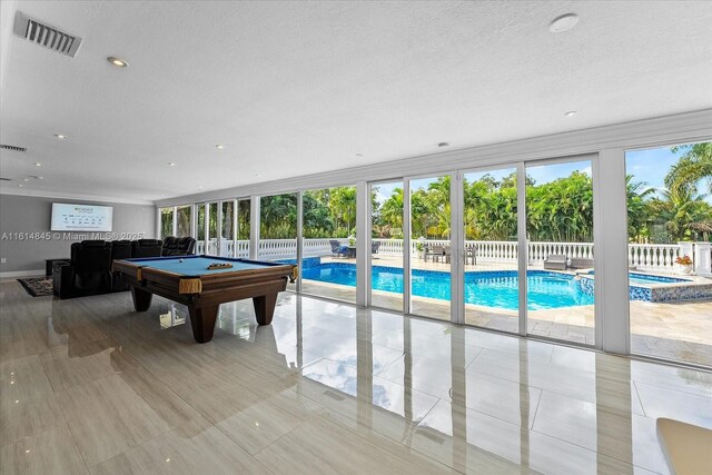 game room with expansive windows and pool table