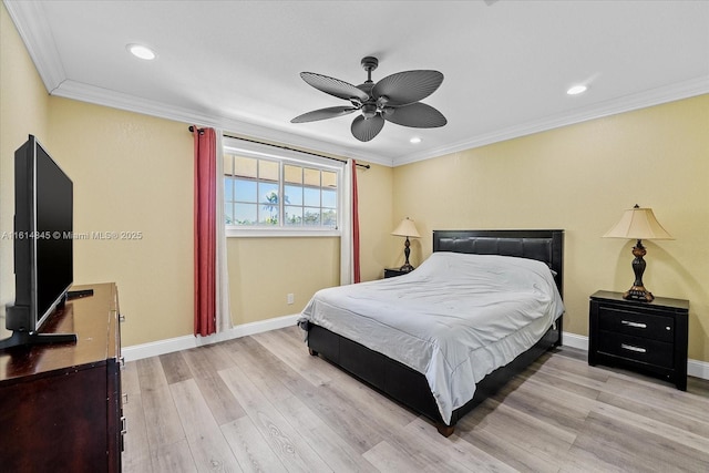 bedroom with ceiling fan, ornamental molding, and light hardwood / wood-style floors