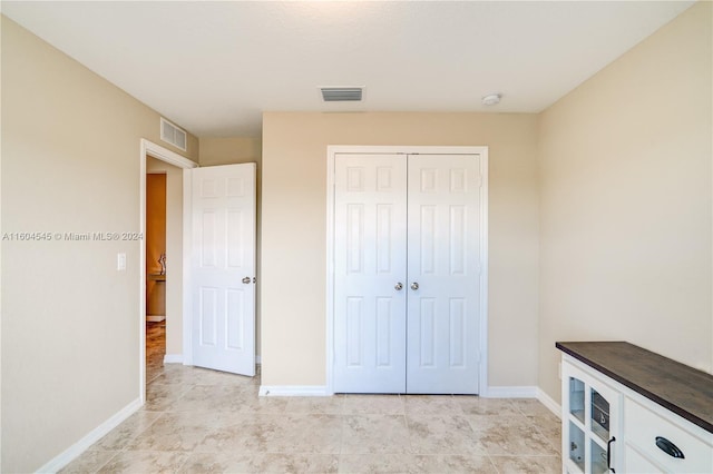 unfurnished bedroom with a closet