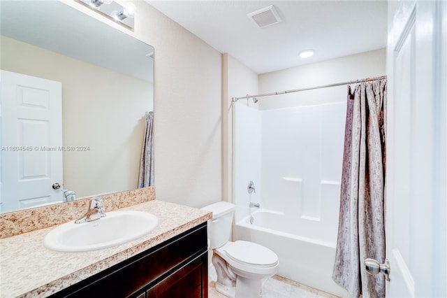 full bathroom featuring tile patterned floors, vanity, shower / bath combo, and toilet