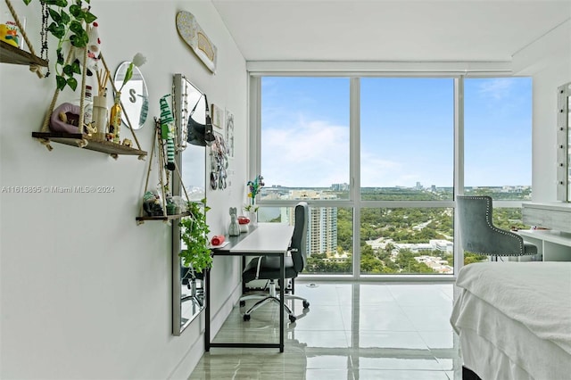 tiled bedroom featuring floor to ceiling windows