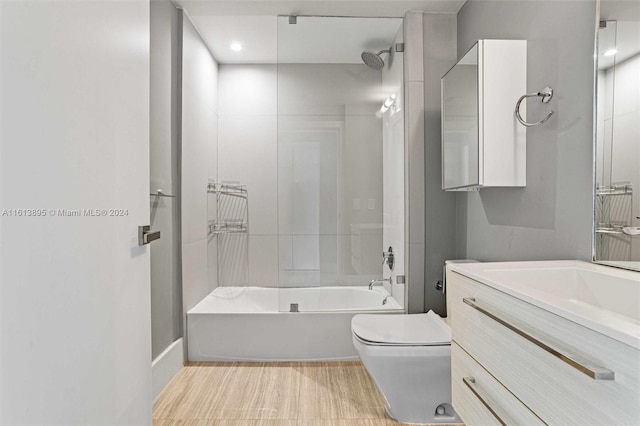 full bathroom with vanity, shower / bath combination, and toilet