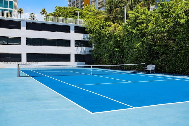 view of sport court featuring basketball hoop