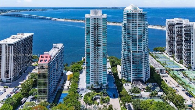 birds eye view of property with a water view