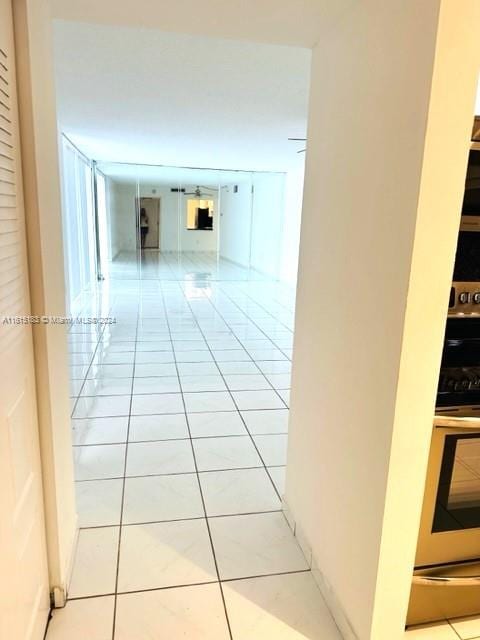 hallway with light tile patterned floors