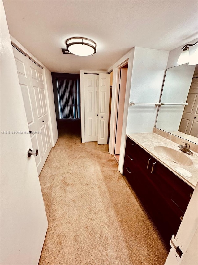 bathroom with vanity and a textured ceiling