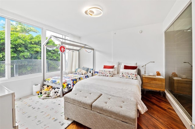 bedroom featuring hardwood / wood-style flooring