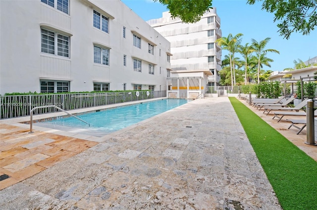 view of swimming pool with a patio