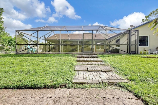 exterior space with a lawn and a lanai