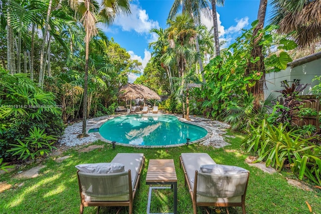 view of swimming pool with a gazebo and a lawn