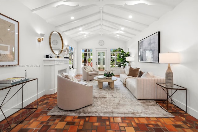 living room featuring vaulted ceiling with beams