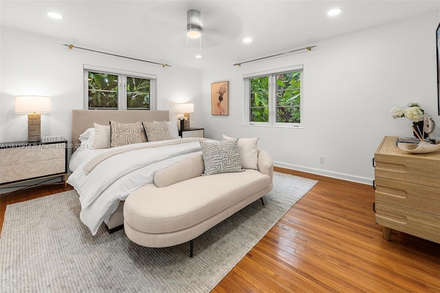 bedroom with hardwood / wood-style floors and ceiling fan