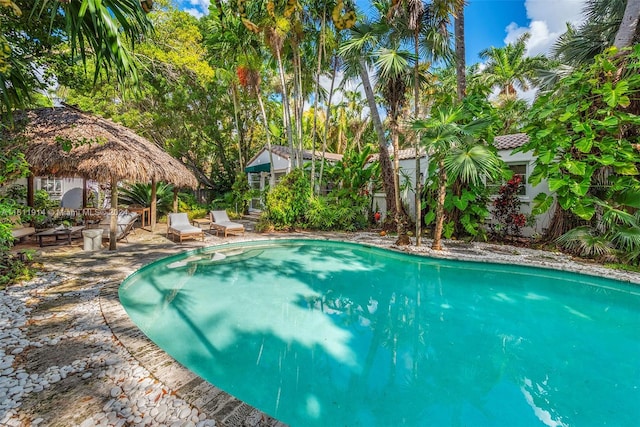 view of swimming pool with a gazebo and a patio area