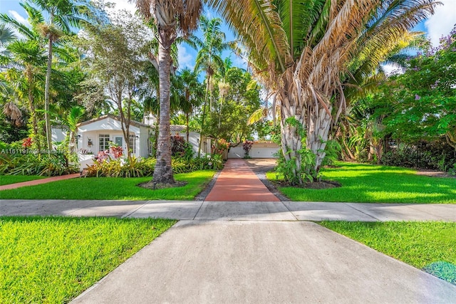 view of front of property with a front yard and a garage