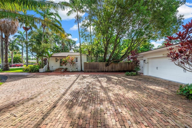 view of side of home featuring a garage